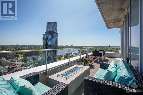 East-facing patio with more lake views as well as views of the city skyline. Another natural gas hook up here, ideal for a gas fire pit to cozy around on the chillier summer evenings. - 111 Champagne Avenue S Unit#2004, Ottawa, ON - Outdoor With Body Of Water With View With Exterior