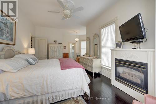 239 Main Street E, Grimsby, ON - Indoor Photo Showing Bedroom With Fireplace
