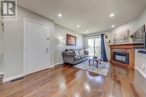 36 - 2530 Northampton Boulevard, Burlington, ON - Indoor Photo Showing Living Room With Fireplace