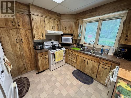 200 1St Street W, Dinsmore, SK - Indoor Photo Showing Kitchen With Double Sink