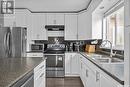 1010 Riverside Drive, Prince Albert, SK  - Indoor Photo Showing Kitchen With Stainless Steel Kitchen With Double Sink 