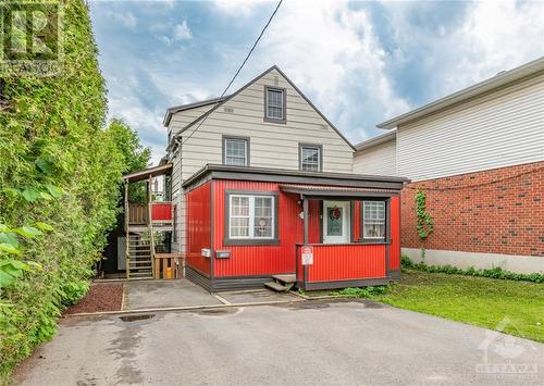 Entrance to the upper unit is up the stairs on the left. The lower unit side entrance is under the stairs on the left. ground floor unit entrance off of the driveway 4 car driveway - 174 Columbus Avenue, Ottawa, ON - Outdoor