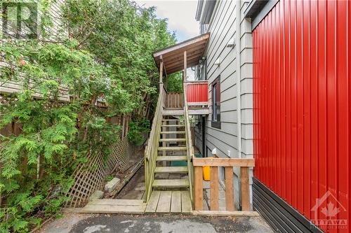 Up the stairs to the vacant 3 bedroom unit and under the stairs to the 1 bedroom legal non-conforming unit and the backyard - 174 Columbus Avenue, Ottawa, ON - Outdoor