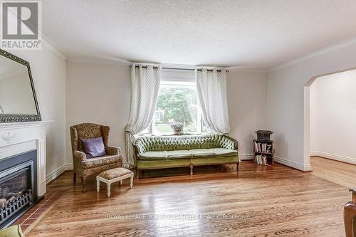 12 Glenellen Drive W, Toronto, ON - Indoor Photo Showing Living Room With Fireplace