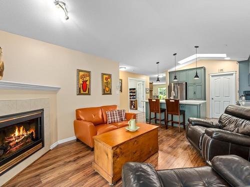 110-2077 St. Andrews Way, Courtenay, BC - Indoor Photo Showing Living Room With Fireplace