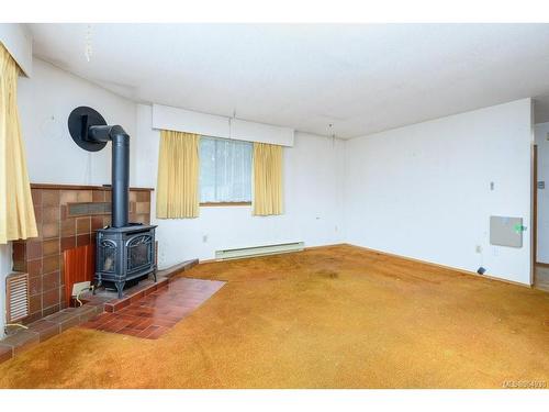 3330 Egremont Rd, Cumberland, BC - Indoor Photo Showing Other Room With Fireplace