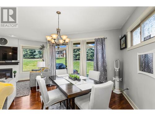 4145 Solana Place, West Kelowna, BC - Indoor Photo Showing Dining Room With Fireplace