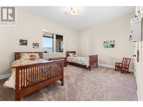 5650 The Edge Place Unit# 105, Kelowna, BC - Indoor Photo Showing Bedroom