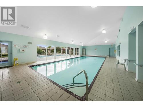 595 Yates Road Unit# 415, Kelowna, BC - Indoor Photo Showing Other Room With In Ground Pool