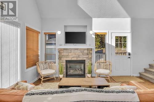 6952 Terazona Drive Unit# 408, Kelowna, BC - Indoor Photo Showing Living Room With Fireplace