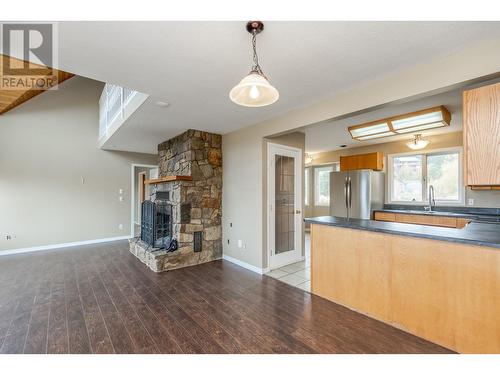 4661 June Springs Road, Kelowna, BC - Indoor Photo Showing Kitchen With Fireplace