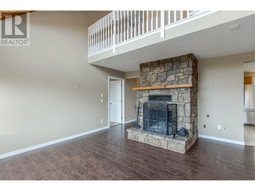 4661 June Springs Road, Kelowna, BC - Indoor Photo Showing Other Room With Fireplace