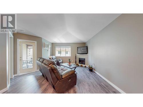 921 Spillway Road Unit# 309A, Oliver, BC - Indoor Photo Showing Living Room With Fireplace