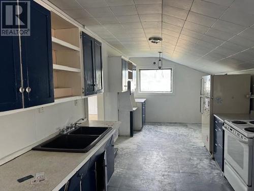 693 Ninth Avenue, Midway, BC - Indoor Photo Showing Kitchen With Double Sink