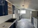 693 Ninth Avenue, Midway, BC  - Indoor Photo Showing Kitchen With Double Sink 