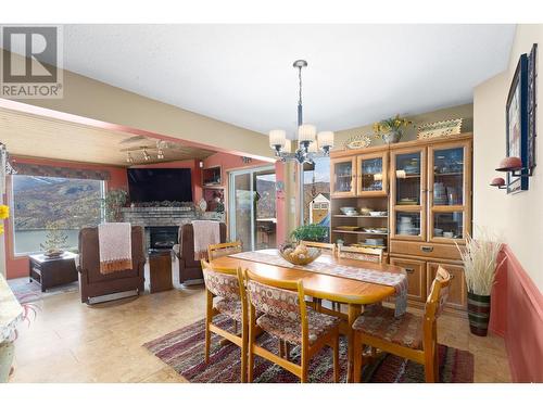 482 Clifton Road N, Kelowna, BC - Indoor Photo Showing Dining Room With Fireplace