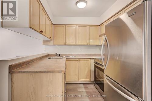 103 - 1150 Parkwest Place, Mississauga, ON - Indoor Photo Showing Kitchen With Double Sink