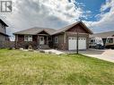 909 89 Avenue, Dawson Creek, BC  - Outdoor With Facade 