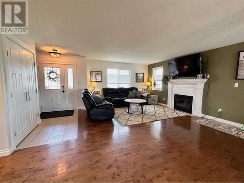 909 89 Avenue, Dawson Creek, BC - Indoor Photo Showing Living Room With Fireplace
