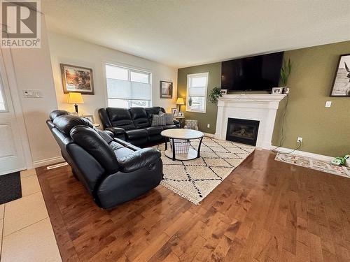 909 89 Avenue, Dawson Creek, BC - Indoor Photo Showing Living Room With Fireplace