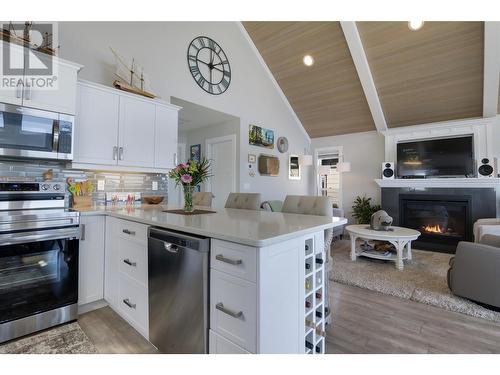 6971 Terazona Drive Lot# 439, Fintry, BC - Indoor Photo Showing Kitchen With Fireplace