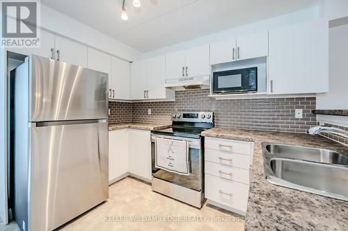 312 - 2035 Appleby Line, Burlington, ON - Indoor Photo Showing Kitchen With Double Sink With Upgraded Kitchen