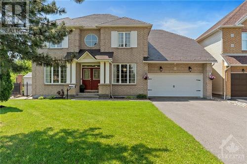 Gorgeous two-level Minto/Carolina home with 5 bedrooms and 5 bathrooms. It features an inground pool, an attached 2 car garage, and is situated on a beautiful corner lot. - 2181 Des Grands Champs Way, Ottawa, ON - Outdoor With Facade