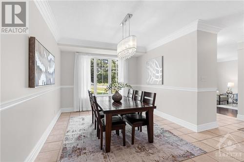 Gorgeous dining room with tiled flooring and large window for natural flowing light. Perfect for family gatherings and traditions. - 2181 Des Grands Champs Way, Ottawa, ON - Indoor Photo Showing Dining Room