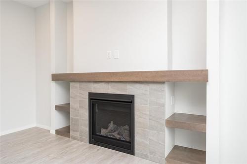 28 Elm Drive, West St Paul, MB - Indoor Photo Showing Living Room With Fireplace