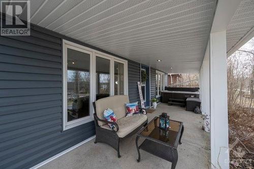 Imagine enjoying your morning coffee or afternoon cocktail on this covered verandah - 171 Gardiner Shore Road, Carleton Place, ON - Outdoor With Deck Patio Veranda With Exterior