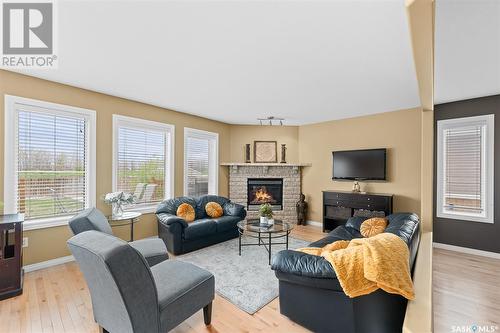 233 Wood Lily Drive, Moose Jaw, SK - Indoor Photo Showing Living Room With Fireplace