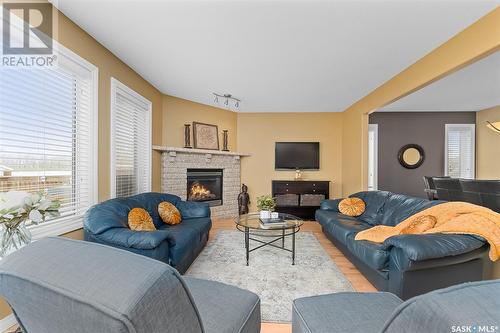 233 Wood Lily Drive, Moose Jaw, SK - Indoor Photo Showing Living Room With Fireplace