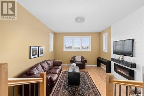 233 Wood Lily Drive, Moose Jaw, SK - Indoor Photo Showing Living Room With Fireplace