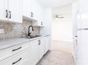218-585 Dogwood St South, Campbell River, BC  - Indoor Photo Showing Kitchen With Double Sink 