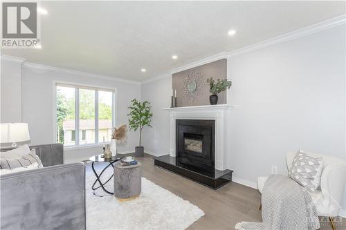 120 Palomino Drive, Kanata, ON - Indoor Photo Showing Living Room With Fireplace