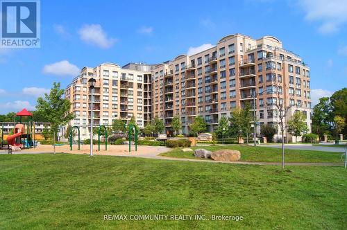 718 - 16 Dallimore Circle, Toronto, ON - Outdoor With Facade