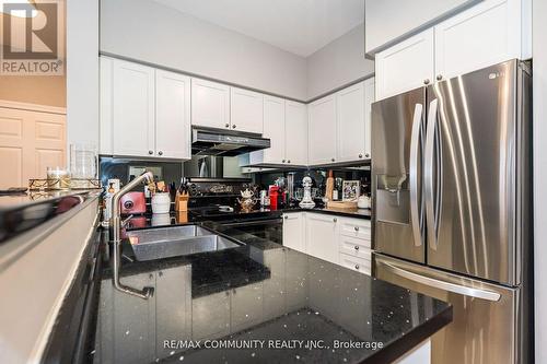 718 - 16 Dallimore Circle, Toronto, ON - Indoor Photo Showing Kitchen With Upgraded Kitchen