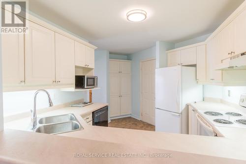 203 - 245 Elgin Street W, Cobourg, ON - Indoor Photo Showing Kitchen With Double Sink