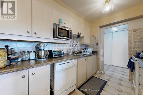 407 - 2835 Islington Avenue, Toronto, ON - Indoor Photo Showing Kitchen With Double Sink