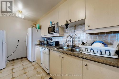 407 - 2835 Islington Avenue, Toronto, ON - Indoor Photo Showing Kitchen With Double Sink