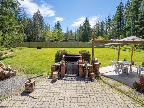 1050 Mclaughlin Pl, Qualicum Beach, BC - Outdoor With Deck Patio Veranda With Backyard