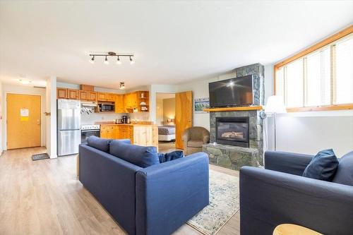 300 - 4559 Timberline Crescent, Fernie, BC - Indoor Photo Showing Living Room With Fireplace