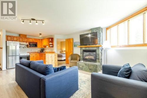 4559 Timberline Crescent Unit# 300, Fernie, BC - Indoor Photo Showing Living Room With Fireplace