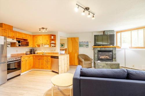 300 - 4559 Timberline Crescent, Fernie, BC - Indoor Photo Showing Other Room With Fireplace