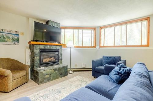 300 - 4559 Timberline Crescent, Fernie, BC - Indoor Photo Showing Living Room With Fireplace