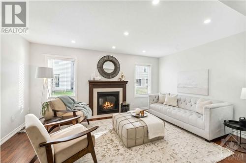 124 Cranesbill Road, Ottawa, ON - Indoor Photo Showing Living Room With Fireplace