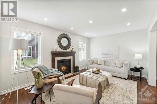 124 Cranesbill Road, Ottawa, ON - Indoor Photo Showing Living Room With Fireplace