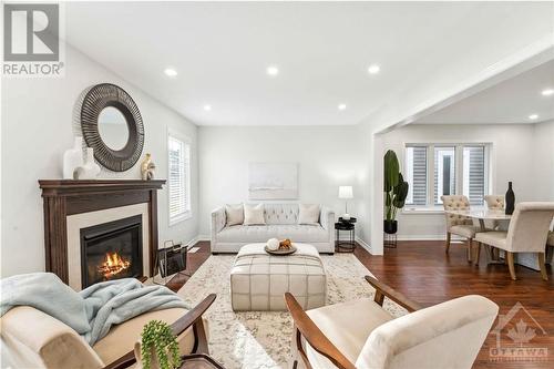 124 Cranesbill Road, Ottawa, ON - Indoor Photo Showing Living Room With Fireplace