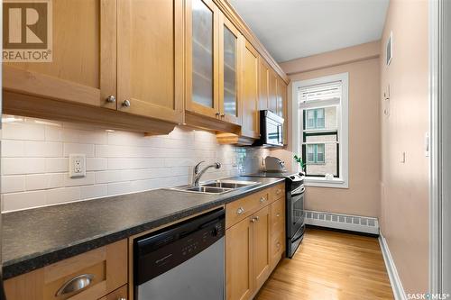 210 2305 Victoria Avenue, Regina, SK - Indoor Photo Showing Kitchen With Double Sink