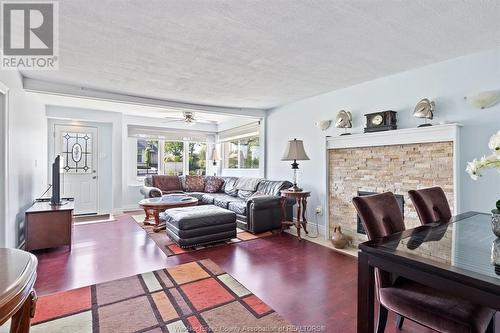 7045 Riverside Drive East, Windsor, ON - Indoor Photo Showing Living Room With Fireplace